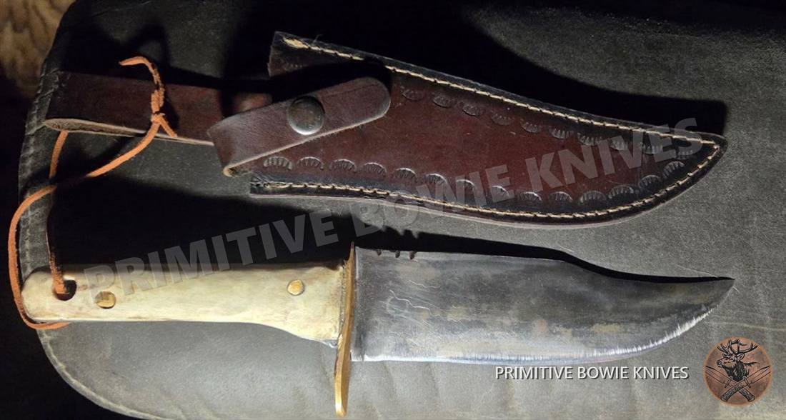 Bowie with tooled leather sheath, a handmade elk stag knife that has been sold